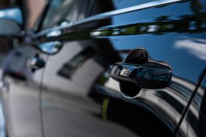 close up view of handle of black car door